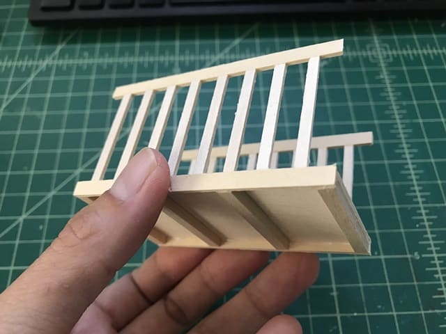 partially assembled dollhouse crib sides