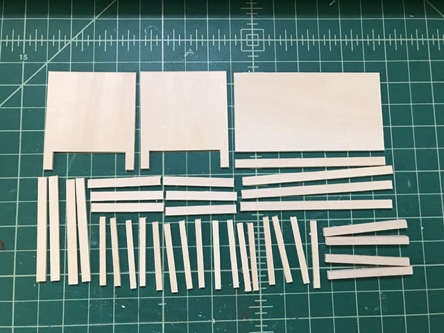 cutouts of basswood for making dollhouse crib