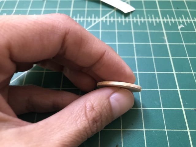 showing thickness of circle template at about 1/16 inch