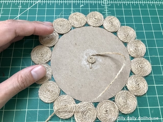 spriraling jute twine to make dollhouse miniature jute rug