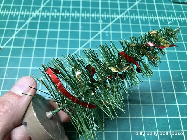 strips of metallic paper wrapped into mini sisal tree