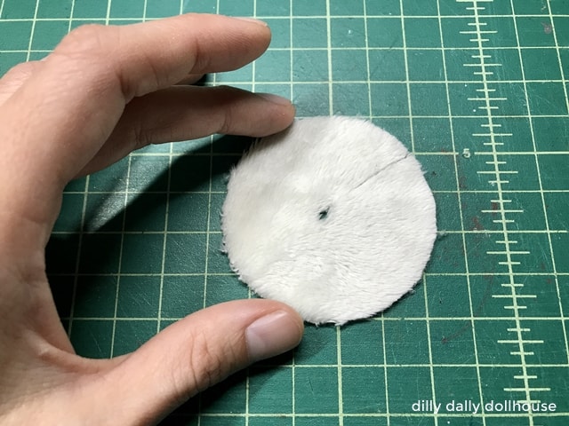 furry fabric cut in a circle for mini Christmas tree skirt