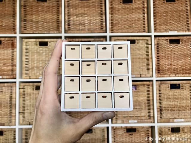 miniature ikea kallax held by hand