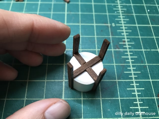 legs of dollhouse planter are attached