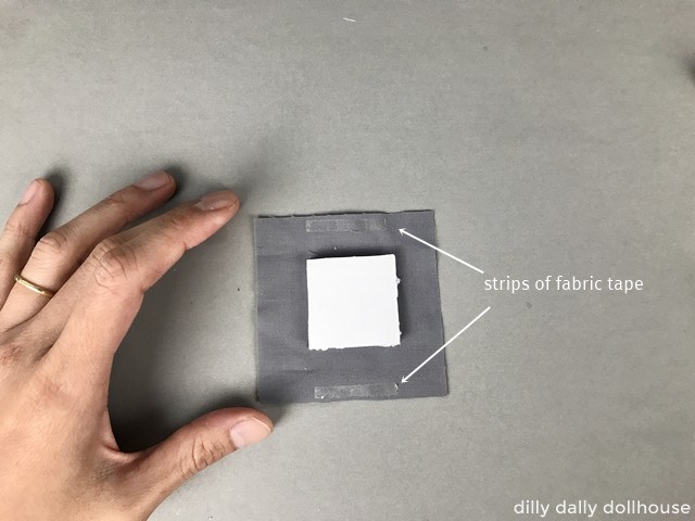 a piece of foam core on top of a bigger piece of fabric