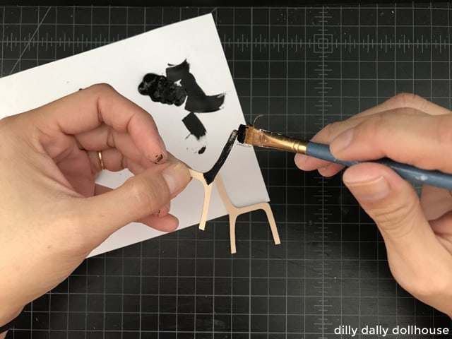 dollhouse chair sides being painted