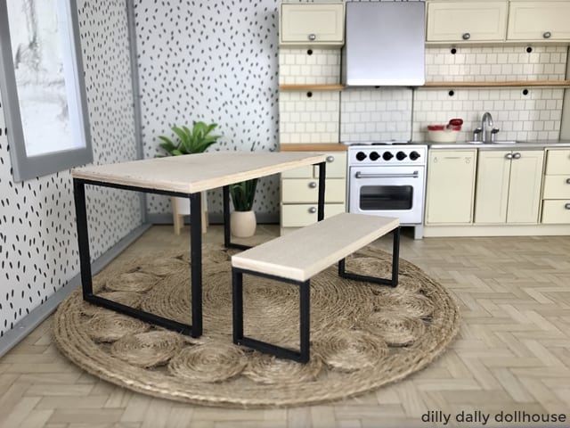 Industrial-style miniature table and bench in dollhouse kitchen scene