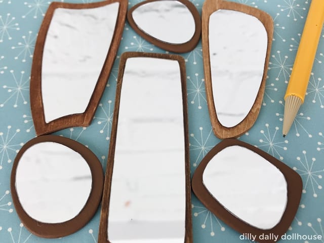 a grouping of mid-century dollhouse mirrors