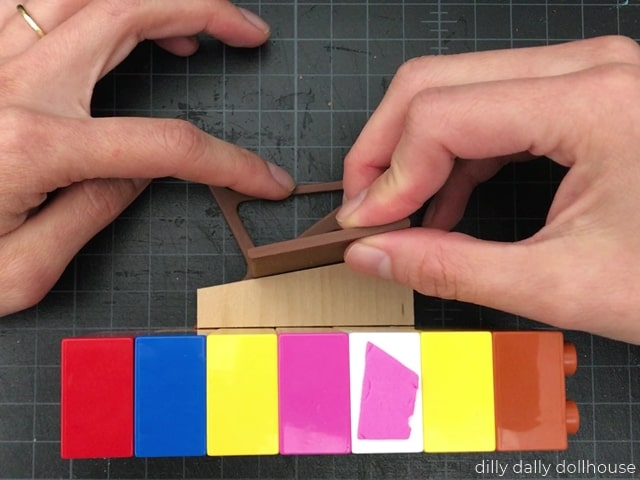 seat attached to the side of dollhouse chair