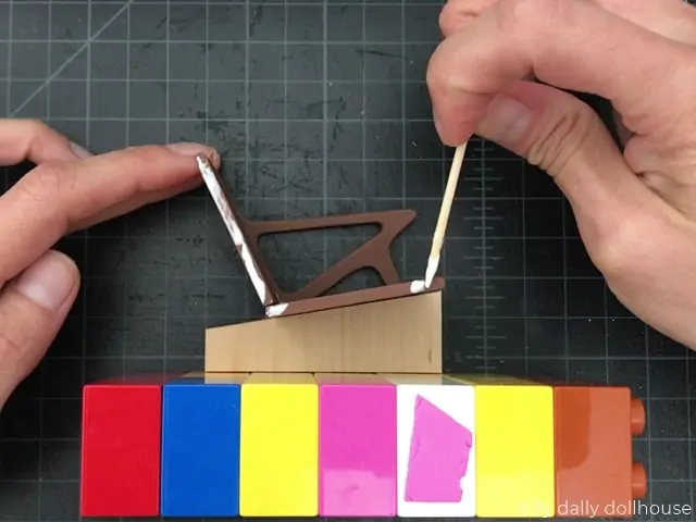 glue applied to the side of miniature chair